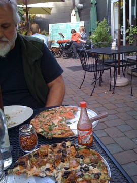 Ted Killian and I eating vegan pizza at Pizza Research Institute